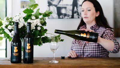 Stephanie pouring wine for tasting in the cellar door