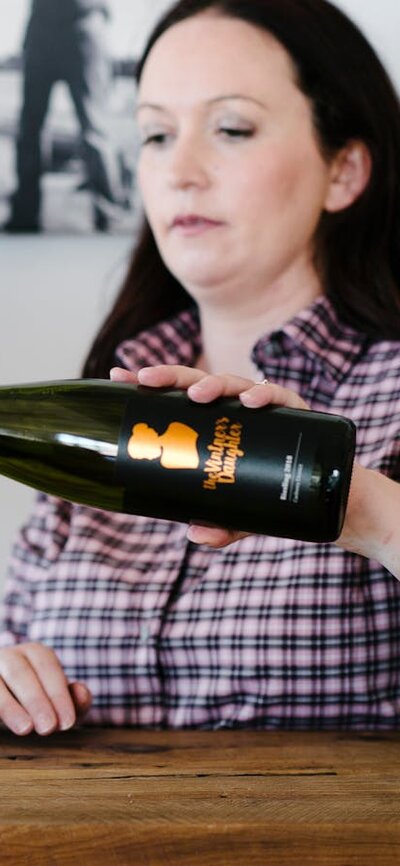 Stephanie pouring wine for tasting in the cellar door