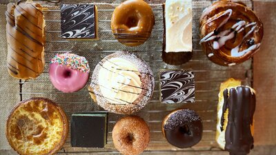 trapper donuts with chocolate eclairs and apple pies