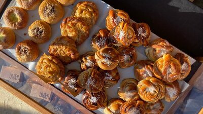 A tray of golden pastries from a birds eye view