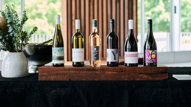 Taste Canberra wines at the Canberra Cellar Door A line up of six Canberra wines on a wooden plinth