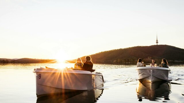 Explore Lake Burley Griffin Two boats on the water at sunset