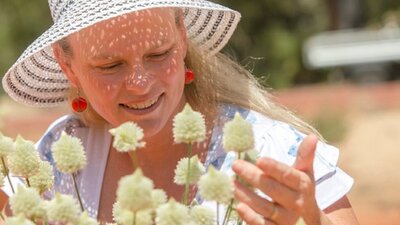 Visitor looking at beautiful white flowers