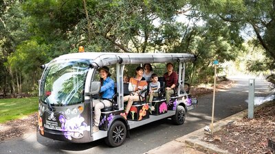 Adults and children on board the Flora Explorer electric bus