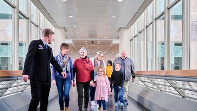 A group of people walking forward