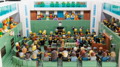 Plastic toys seated in various positions
