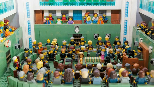 Plastic toys seated in various positions