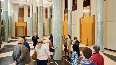 People during a tour in the Marble Foyer of Parliament House