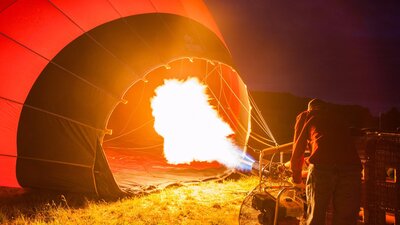 Operator inflating a hot air balloon