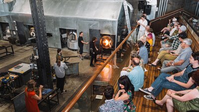 Visitors watching glass blowing
