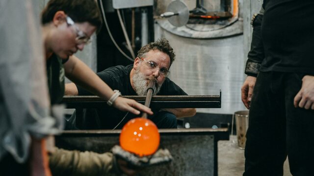 Artists glass blowing in the Hotshop Artists glass blowing in the Hotshop