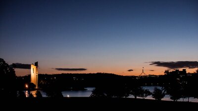 Canberra at sunset showing the Carillon bell tower and Parliament House