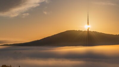 Telstra tower at sunrise with fog
