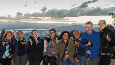 Smiling Capturing Canberra Photo group atop Mt Ainslie
