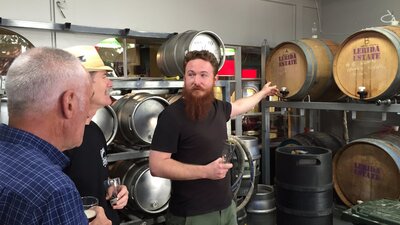 Men in the barrel room at Wig & Pen