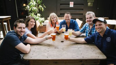 Tour participants with a cold beer