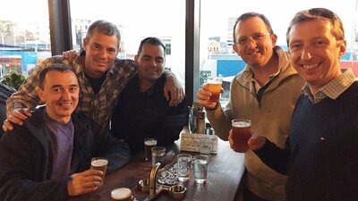 Five men with beer