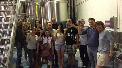 Tour group with beers in hand at the BentSpoke Cannery