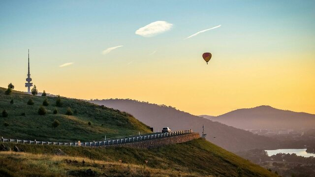 Draft over the nation's capital at dawn Hot air balloon over the Canberra bushland