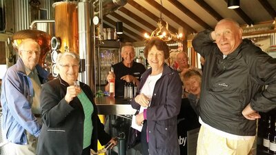 Six seniors in front of schnapps bar