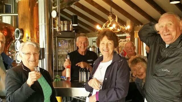 Schnapps anyone? Six seniors in front of schnapps bar