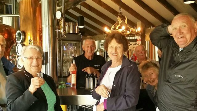 Schnapps anyone? Six seniors in front of schnapps bar
