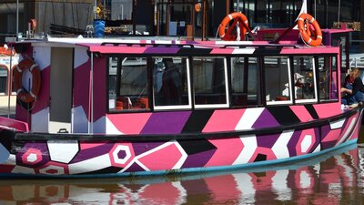 Brightly coloured boat on the water