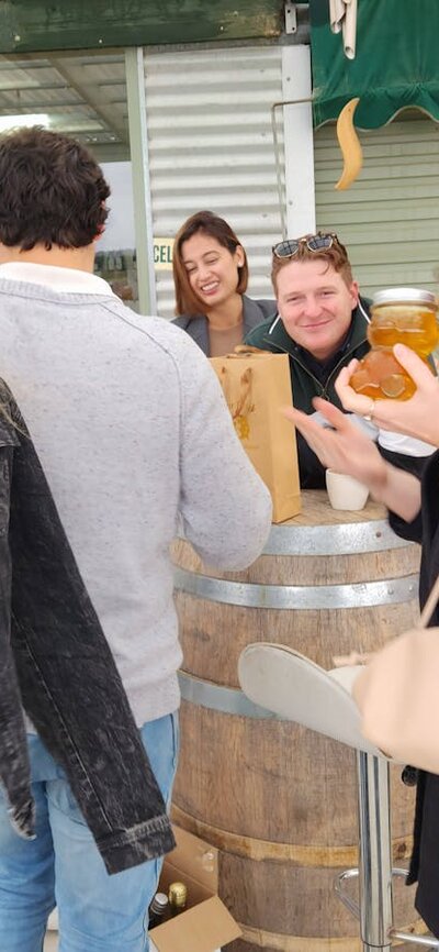 Tour guests holding honey at Jeir Creek Winery