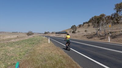 XPT train passing cyclist