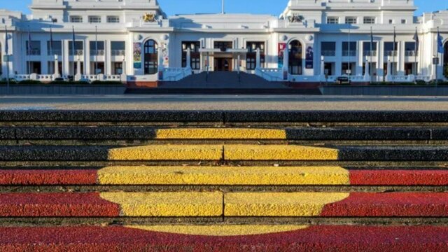 The Aboriginal flag painted on the steps in front of Old Parliament House
