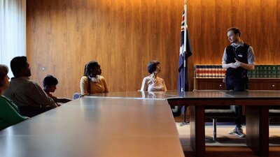 A group of people seated at the Cabinet Room