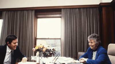 Joan Child sitting at her desk in the Speaker's Suite