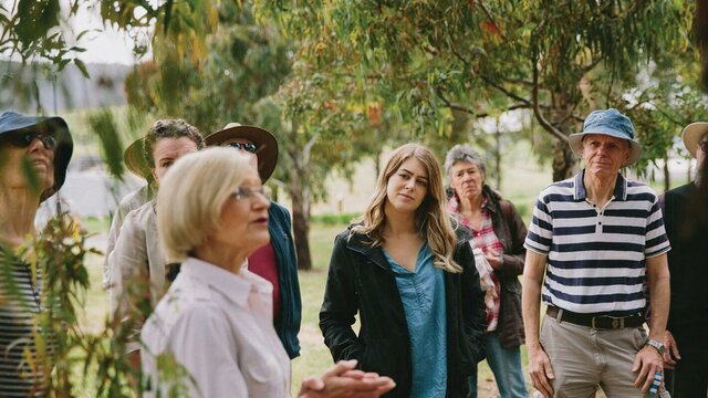 A volunteer guide delivering a forest walk Forest Walk