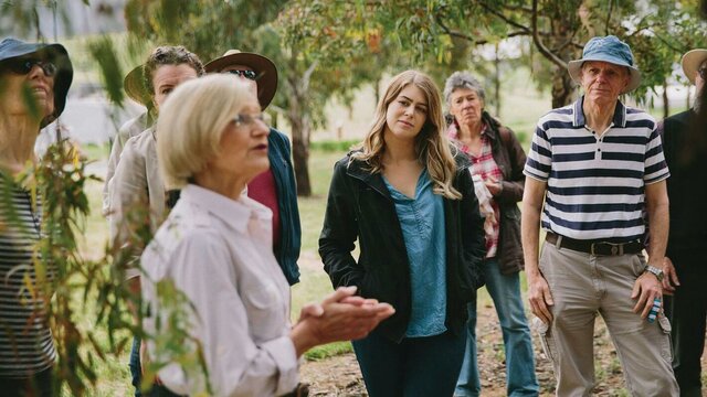 A volunteer guide delivering a forest walk Forest Walk