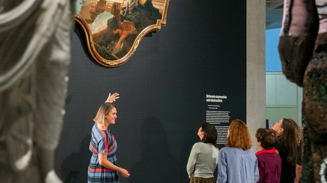 Guided tour, National Gallery of Australia, Kamberri/Canberra, 2024 A group of people admiring a painting in a Gallery