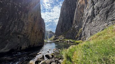 Looking down a limestone gorge with the dun shining through.