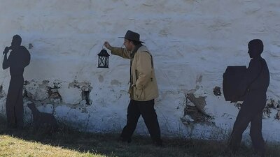 Man holding an oil lamp