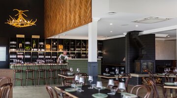 The interior of a new and modern cellar door and restaurant.