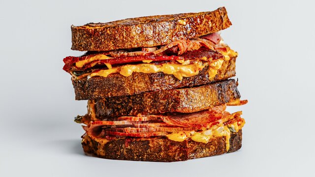 Two sandwiches stacked on top of each other.