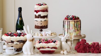 A display of easter-themed desserts and bunny decorations