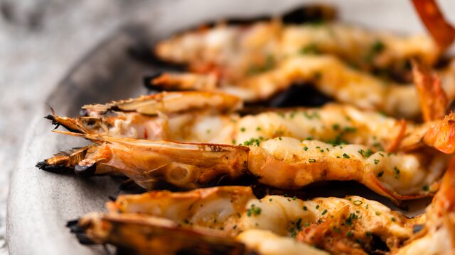 Bright split cooked prawns with seasoning