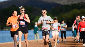People running while smiling