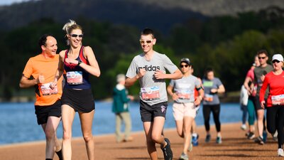 People running while smiling