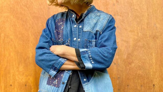 A person modelling a denim jacket