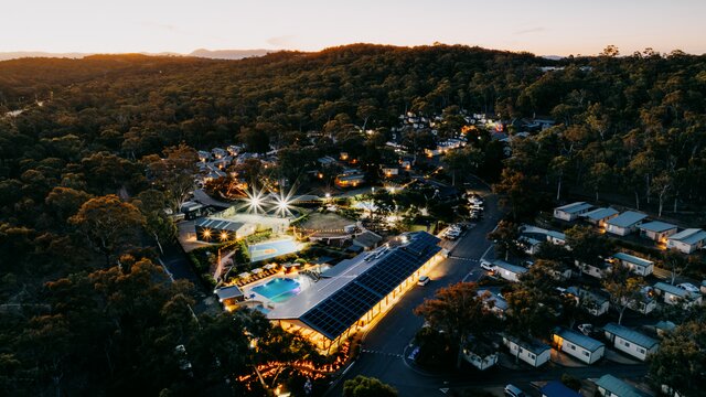 A night aerial shot of a large budget accommodation