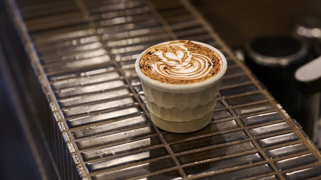 A hot chocolate in a handle-free mug