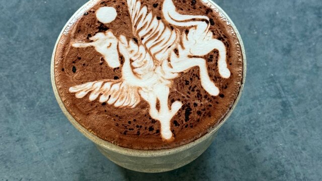 An intricate art on a hot chocolate in a cup