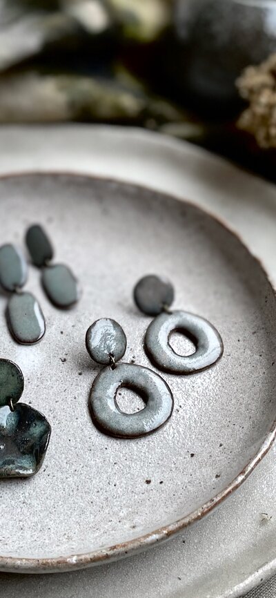 A plate of two pairs of ceramic earrings