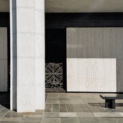 Jenna Rowe National Library of Australia exterior A tight shot of the columns, textures, and shapes of the National Library of Australia building, dappled in sunlight