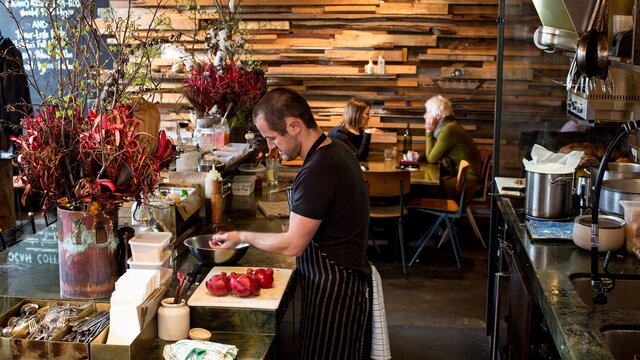 A chef preparing vegetables for brunch.
